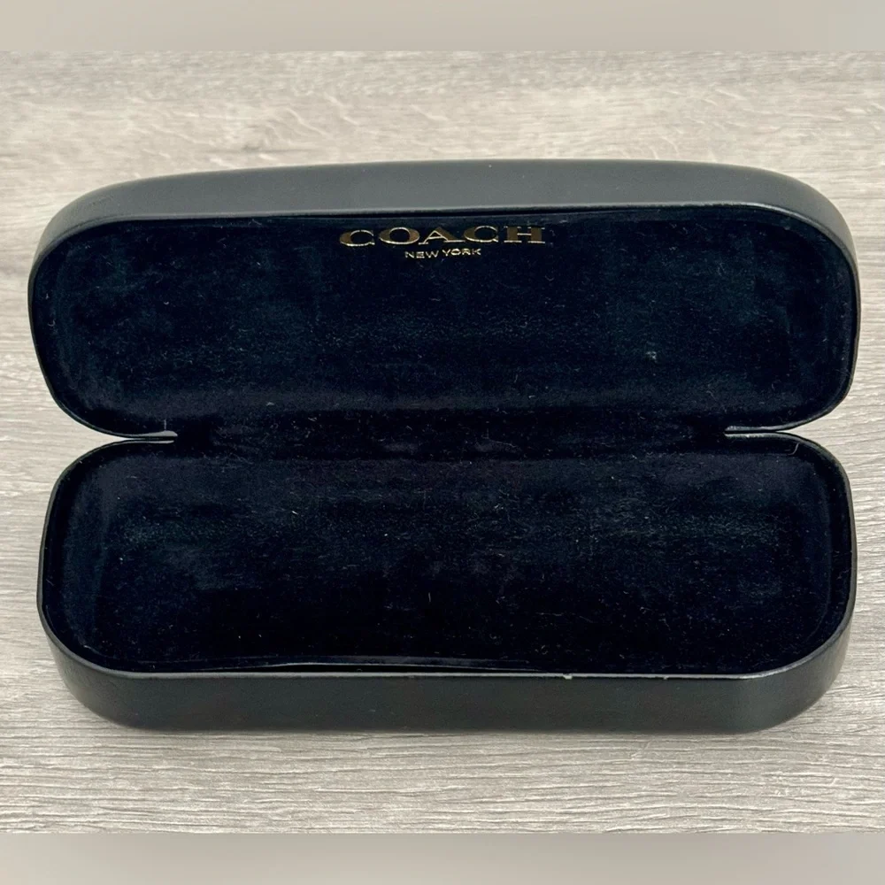 COACH New York Glasses case Black. Used. Has some small dents. See photo.